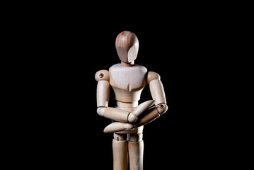 Image of wooden manikin on black background poses different posing