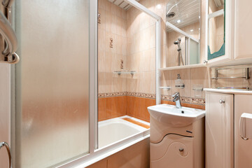 Photo of a bathroom in pastel colors with the lights on
