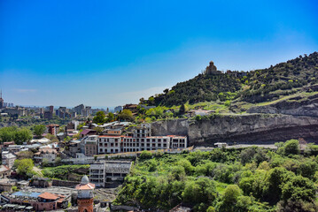 Fototapeta na wymiar Tbilisi, Georgia-April 28, 2019: beautiful bird's-eye view of the city of Tbilisi and the Transfiguration monastery of Tabor in the distance.