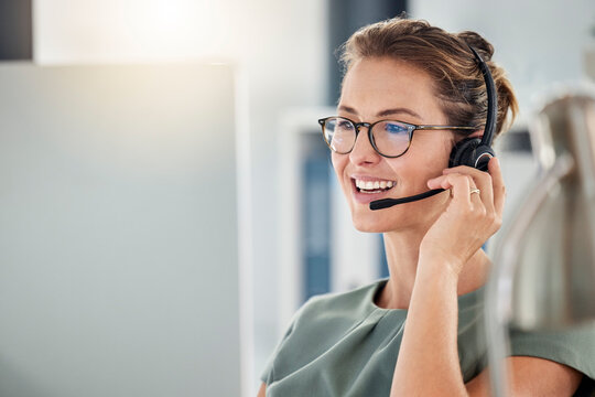 Happy call center woman consulting customer for customer support, help or telemarketing sales. Sales advisor, CRM girl with smile for success customer service, contact us hotline or insurance deal