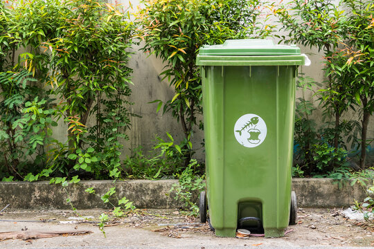 Green garbage recylce bin closeup at the streets.