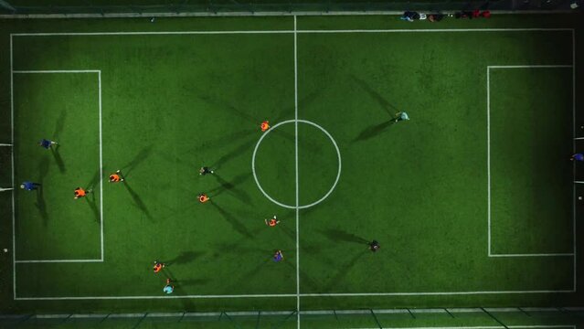 Aerial view of a mini football match, soccer. MiniFootball field and Footballers from drone
