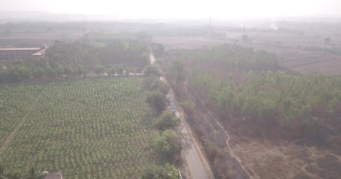 Aerial shot of the Napa Valley with lush greenery and a red roof building in San Francisco