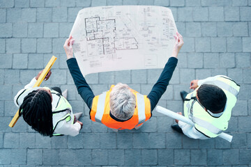 Architect, team and construction blueprint above for building, planning or structure layout to work on site. Business people in architecture with industrial floor plan in teamwork for company project