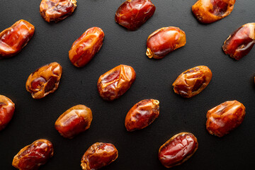 Dates fruit on dark background with copy spaces. Arabian fruit