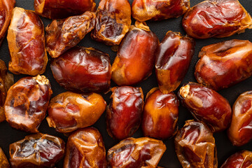 Dates fruit on dark background with copy spaces. Arabian fruit