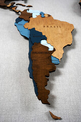 South America, Brazil, Argentina, Chile, Bolivia on a wooden world map. Political color interior...