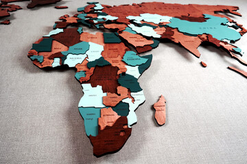Africa on the political map. Wooden world map on the wall.