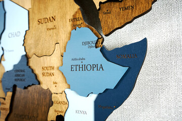 East Africa on the political map. Kenya, Somalia, Ethiopia, Yemen, Uganda, Sudan, South Sudan on wooden world map on the wall. - obrazy, fototapety, plakaty