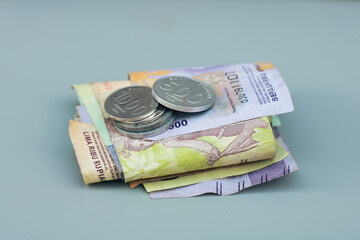 collection of Indonesian state money and coins, with gray copy space or negative space, Indonesian rupiah
