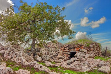 Nuragic hut in the archaeological site of Tamuli. Macomer, Sardinia, Italy - obrazy, fototapety, plakaty