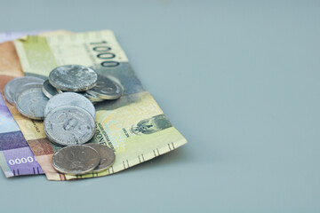 collection of Indonesian state money and coins, with gray copy space or negative space, Indonesian rupiah
