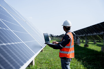 The solar farm(solar panel) with engineers check the operation of the system, Alternative energy to...