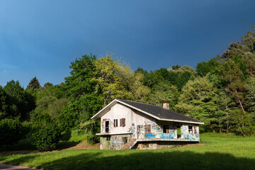 Front picture of an abandoned house in Carballino, Spain, illuminated by the last rays of light before a storm.