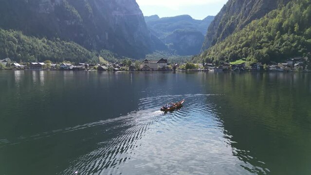 Drone tracking tourist boat  Hallstatt Austria 4k