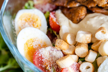 Close up view on Caesar salad in the plate