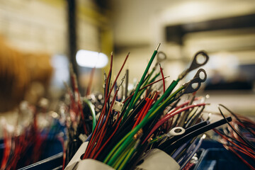 Industrial warehouse cable reels, coils with wound wire fiber optics. Fragment inside modern...