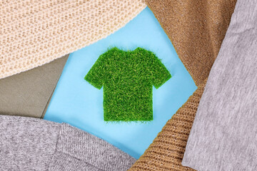 Concept for environmental friendly produced clothing with shirt made out of grass surrounded by...