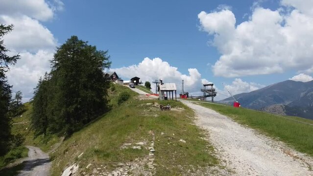 An aerial shot of two people having a picnic in the French Alphs.