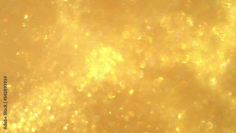 Wall mural waves of golden particles and bokeh. small particles of gold shiny glitter in the form of moving wav