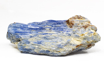 Raw vibrantly blue kyanite crystal stone chunk close up isolated on a white surface background