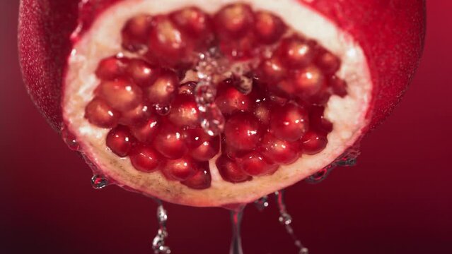 Slow Motion of Flowing Water from Half Pomegranate