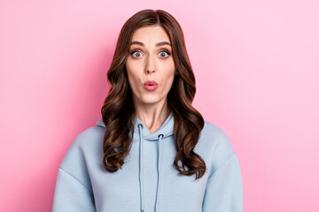 Obraz premium Photo of sweet impressed young lady wear grey hoodie big eyes lips pouted isolated pink color background