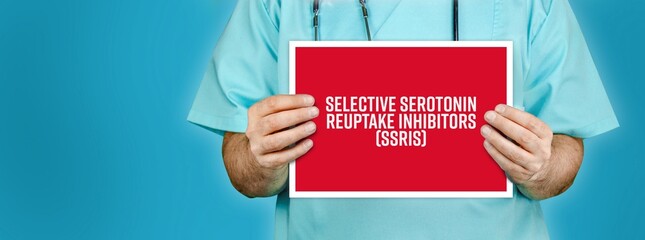 Selective serotonin reuptake inhibitors (SSRIs). Doctor shows red sign with medical word on it....