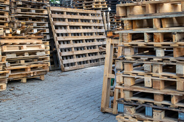 stacks of wooden pallets against the sky