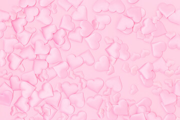 Texture made of textile pink confetti in a heart shape. Monochrome background.