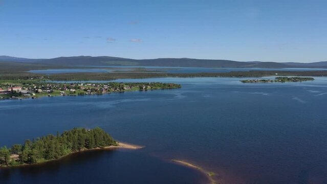 Summer Lapland nature mixing with endless lakes and small town in Sweden, aerial view