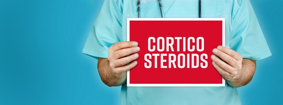 Corticosteroids. Doctor Shows Red Sign With Medical Word On It. Blue Background.