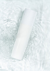 Packaging for cosmetics bottles without logo and label on water background. Mockup cosmetics