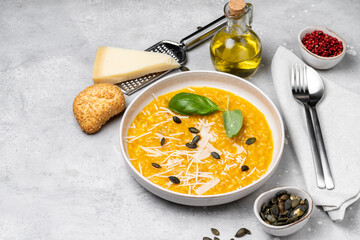 Butternut soup o risotto with pumpkin seeds, with basil and olive oil. seasonal fall menu