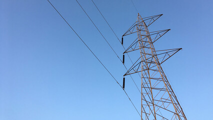 Electricity transmission towers with glowing wires