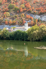 Drought turns trees brown in mid summer on the hills along the river Lot in Cahors, France . Seen...