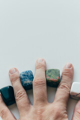 Hand holding healing crystals