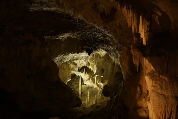 Many stalactite and stalagmite formations inside cave