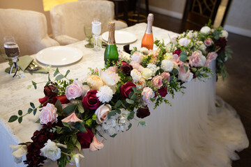 beautiful decorated wedding table with flowers at the banquet