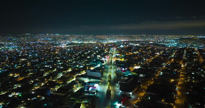 Tijuana city night clouds and traffic