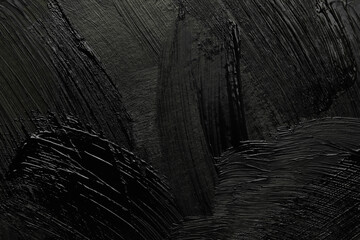 Obraz premium Beautiful strokes of black paint as background, closeup