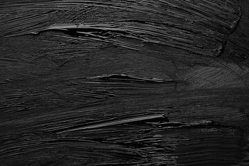 Beautiful strokes of black paint as background, closeup