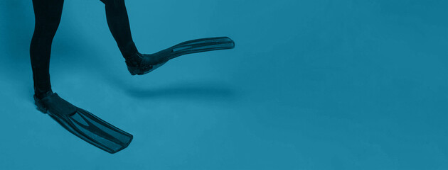 Legs in flipper close up. Travel, sea and sport concept © artmim