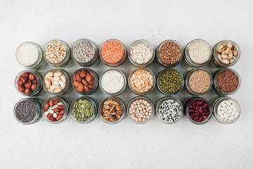 Vegan protein source. assortment of healthy vegetarian food. top view of seeds, nuts, peas, beans,...