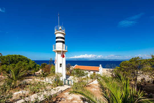 white lighthouse on the shore