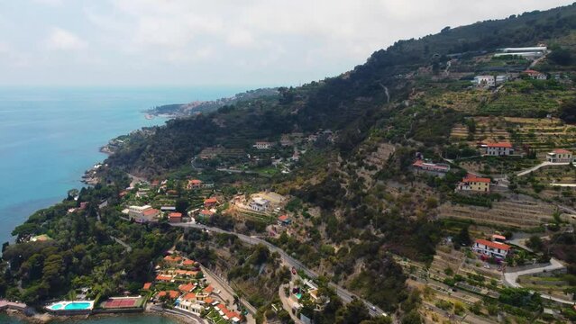 Aerial view of the rural Italian Riviera with its winding roads and rows of vineyards on the hilly Mediterranean coast