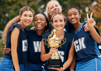 Women, team and winner trophy in fitness game, training match or exercise competition on netball...