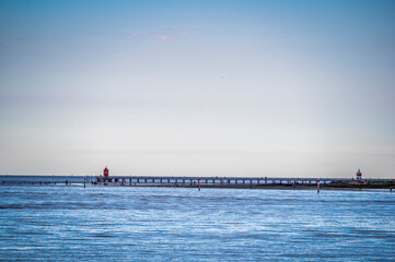 Towards the sunset. Marano lagoon late summer colors. Clouds and sun