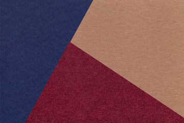 Fototapeta premium Texture of craft navy blue, wine and brown shade color paper background, macro. Vintage abstract cardboard