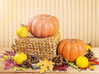 Fresh ripe pumpkins with autumn leaves